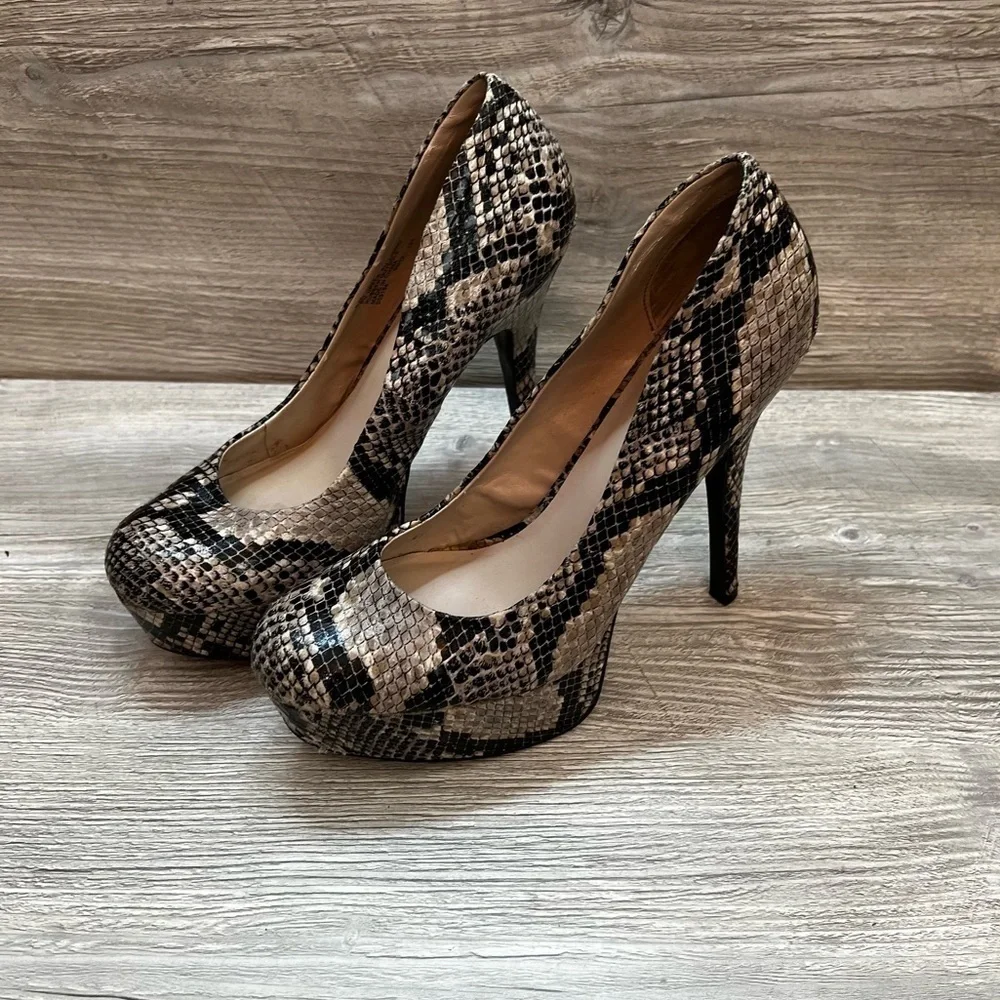 Olsenboye tall platform snakeskin patterned high heels. Closed toe size 9